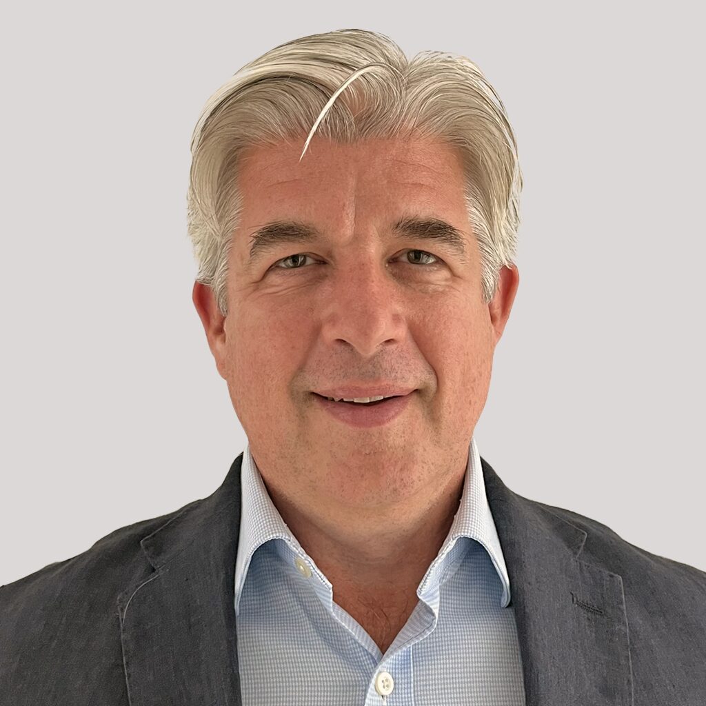 Portrait of Simon Briggs, a seasoned international corporate lawyer at Omnus Law, specializing in global transactions across telecoms, fintech, and education